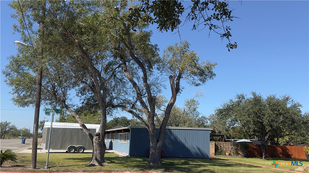 601 Lawrence Street Refugio, TX 78377 - Photo 36 of 42 a view of a house with trees in the background