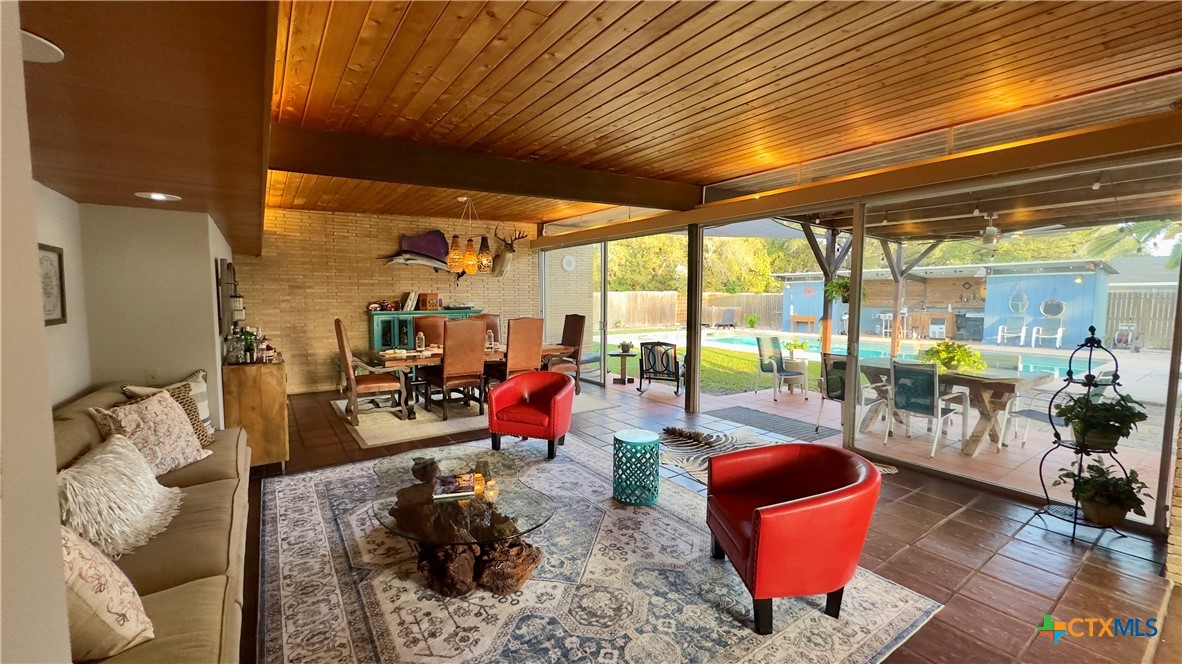 601 Lawrence Street Refugio, TX 78377 - Photo 5 of 42 a living room with furniture a rug and a chandelier