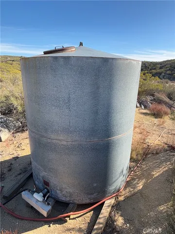 a view of a mountain with a yard