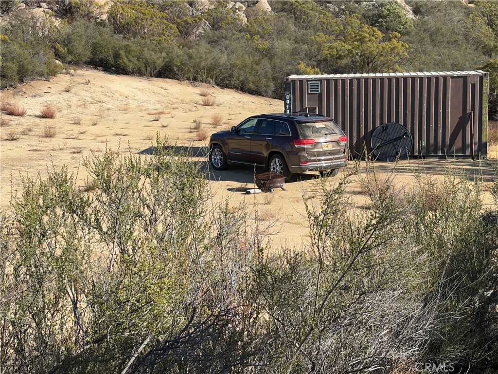 777 Ridgecrest Trail Aguanga, CA 92536 - Photo 16 of 28 a view of a backyard with wooden fence