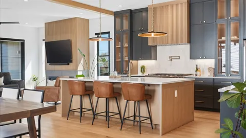 a kitchen with stainless steel appliances granite countertop a stove top oven a sink refrigerator and cabinets