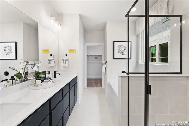 a bathroom with a bathtub and a shower