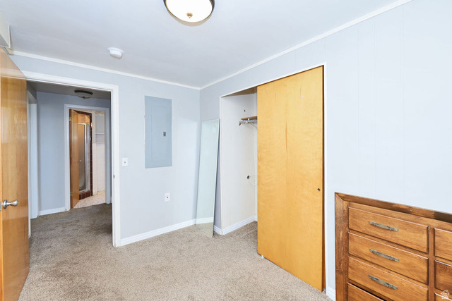 1272 Cook Street Ogden, UT 84404 - Photo 29 of 46 Carpeted room featuring light gray walls, white baseboards, and a flush mount ceiling light