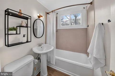 a bathroom with a sink a toilet and a bathtub