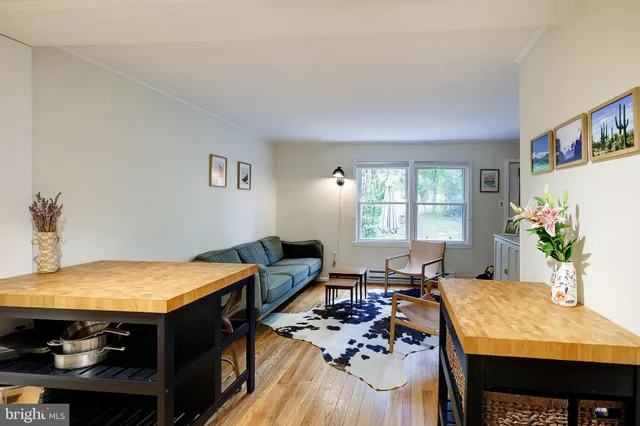 a living room with furniture and flat screen tv