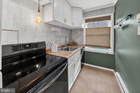 a kitchen with a stove and a refrigerator
