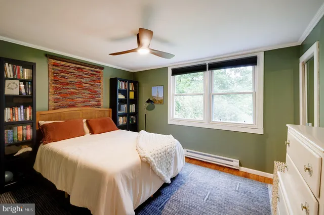 a bedroom with a large bed and a window