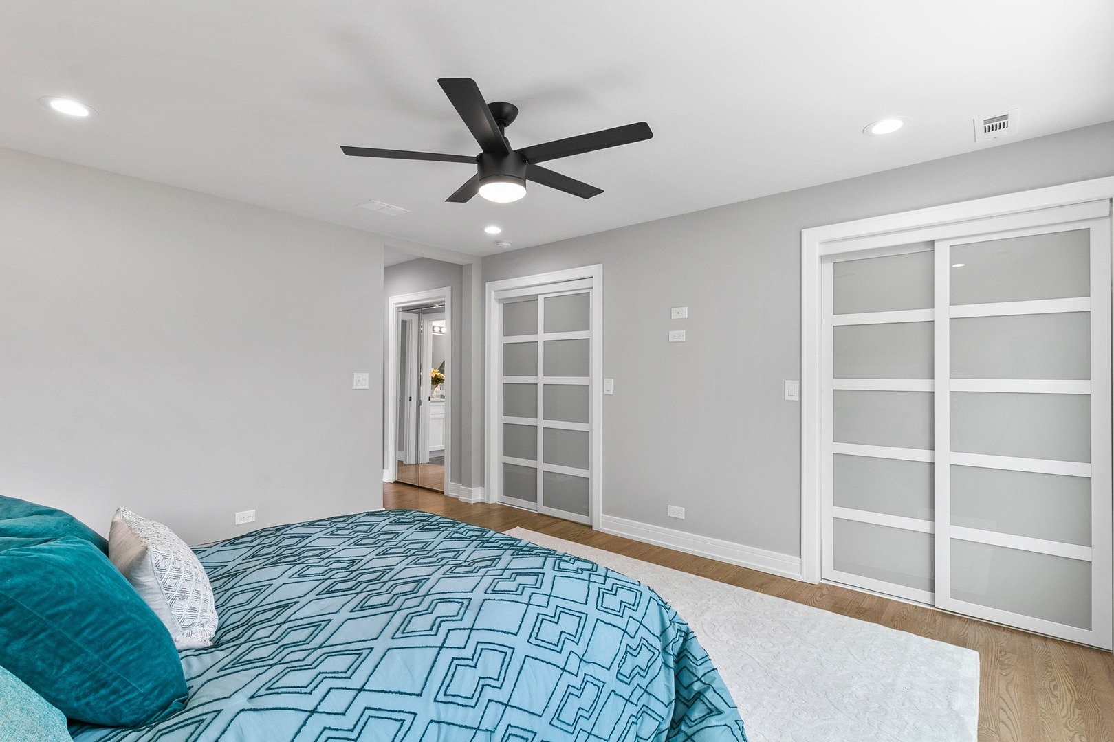 310 Southcote Road Riverside, IL 60546 - Photo 14 of 42 a bedroom with a large bed and a chandelier