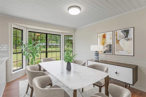 a view of a dining room with furniture window and outside view