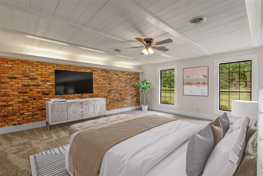 149 Southeast 6th Avenue Sibley, LA 71073 - Photo 18 of 38 a bedroom with a bed television on desk and a window