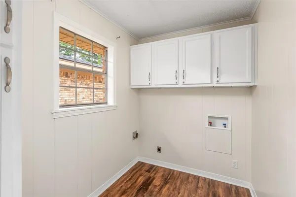 a view of storage and utility room with window