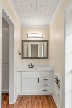 a bathroom with a sink a vanity and a mirror