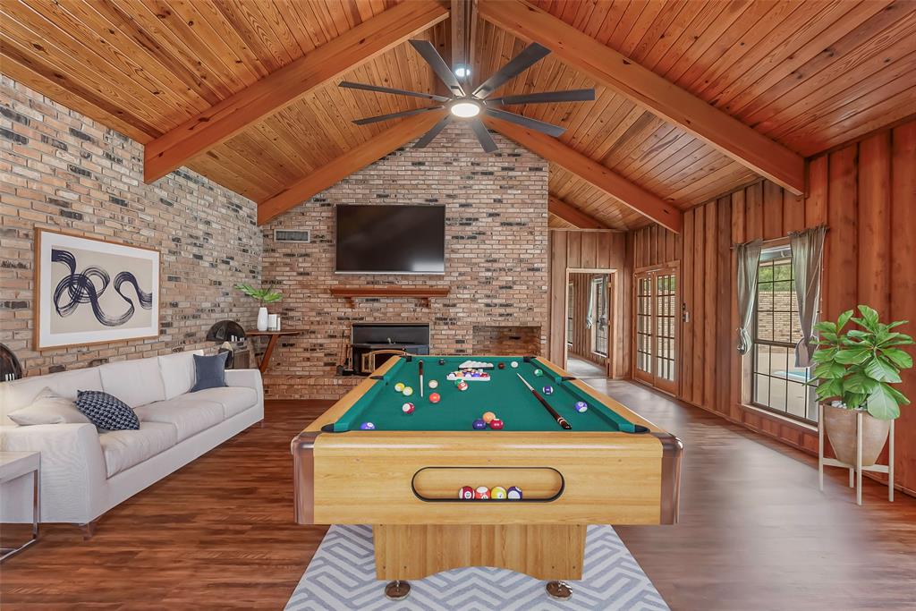 149 Southeast 6th Avenue Sibley, LA 71073 - Photo 33 of 38 a living room with furniture a fireplace and a flat screen tv
