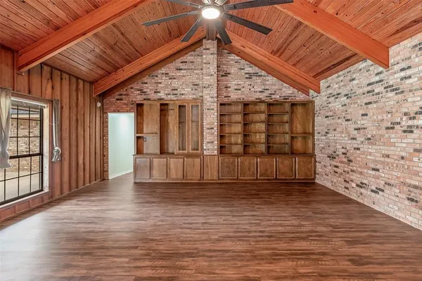 a view of a room with wooden walls