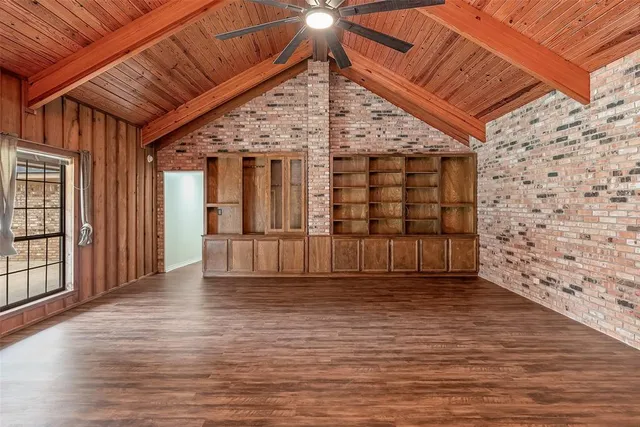 a view of a room with wooden walls