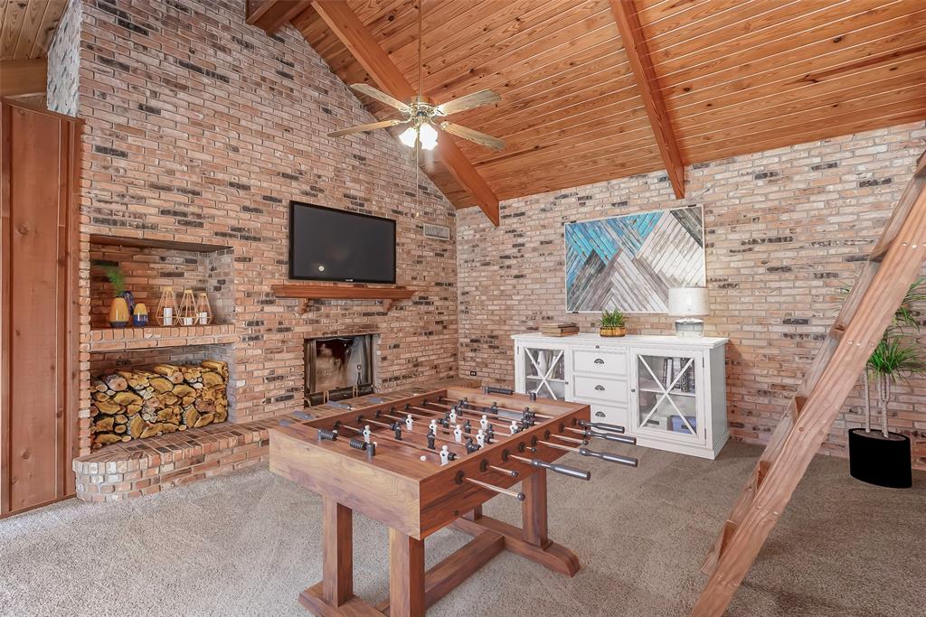 149 Southeast 6th Avenue Sibley, LA 71073 - Photo 37 of 38 a living room with a couch a fireplace and a flat screen tv