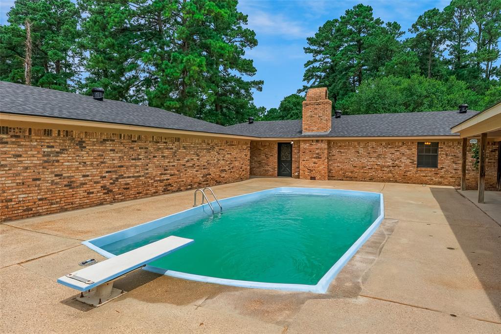 149 Southeast 6th Avenue Sibley, LA 71073 - Photo 6 of 38 a view of a pool with a backyard