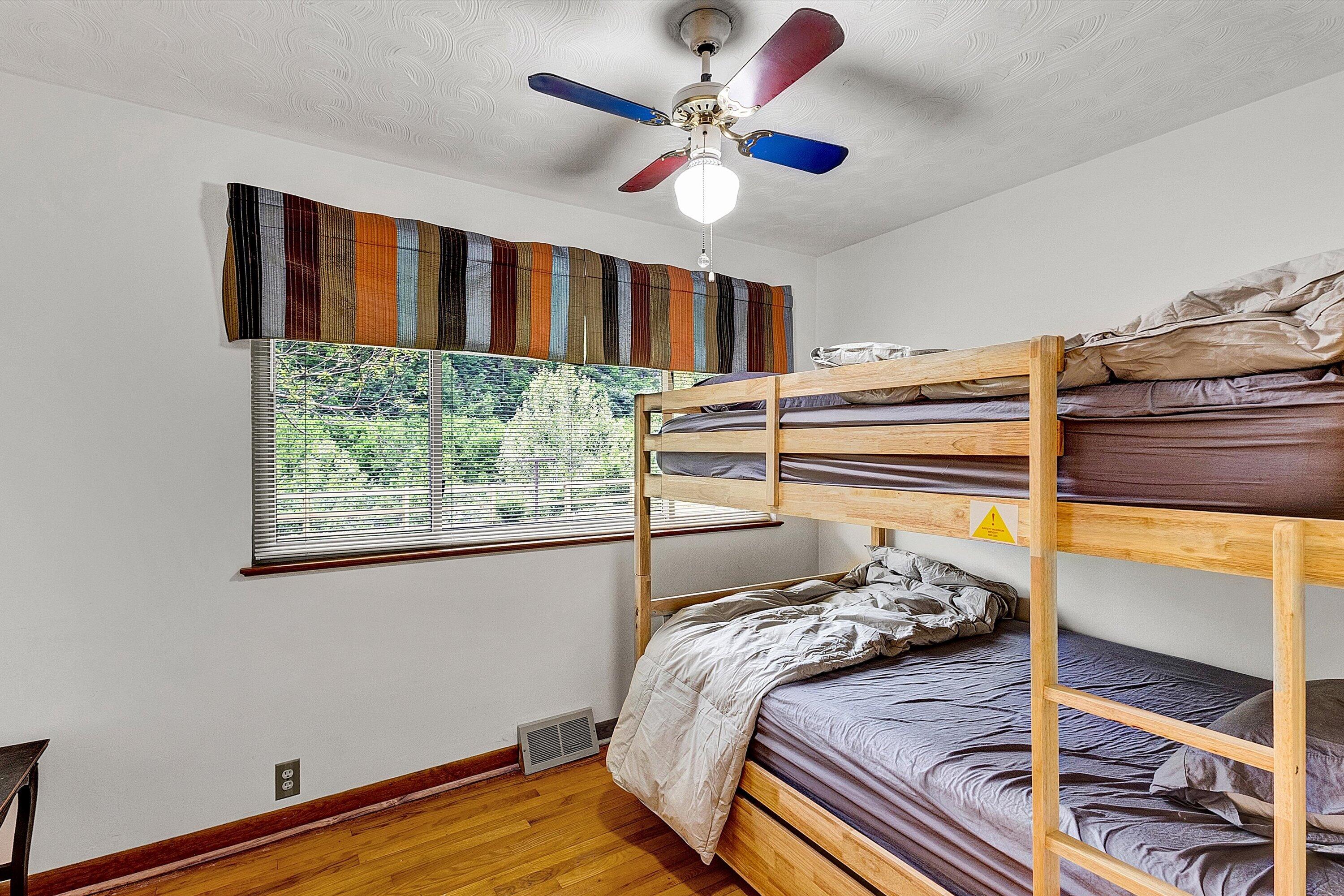 2015 Evergreen Road Covington, VA 24426 - Photo 16 of 46 a bed sitting in a bedroom next to a window