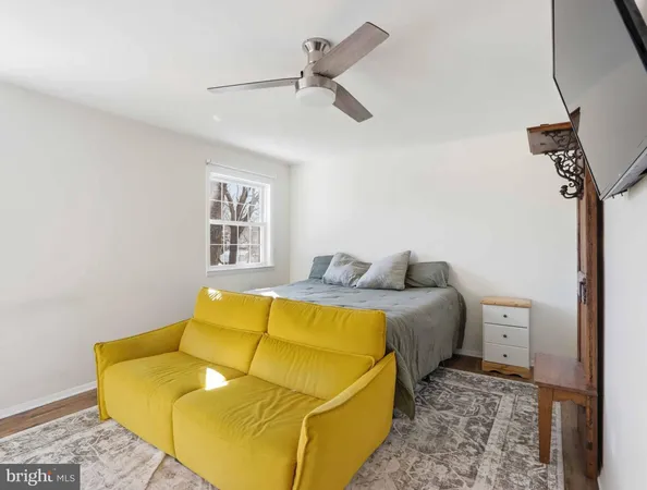 a bed room with a bed and chair