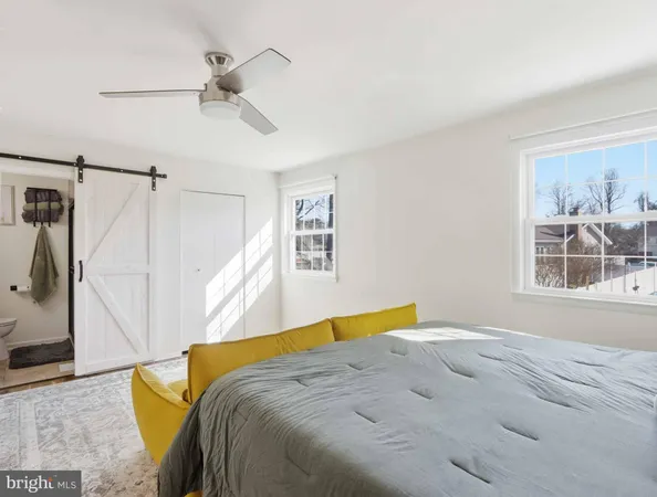 a bed room with a bed and a window