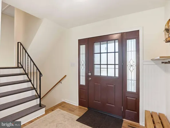 a view of staircase with wooden floor and a potted plant