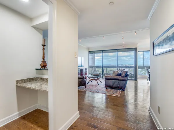 a living room with furniture and a large window