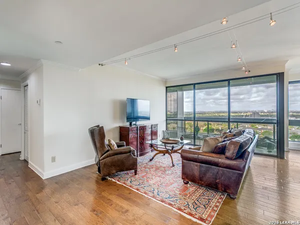 a living room with furniture and a large window