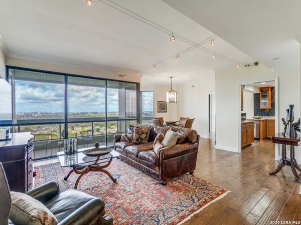 a kitchen with stainless steel appliances granite countertop a refrigerator a stove and a sink