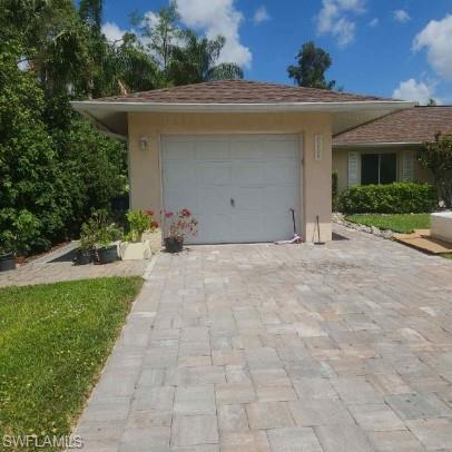 9209 Seville Road Fort Myers, FL 33967 - Photo 2 of 13 a view of a house with a yard