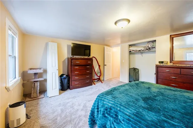 a bed room with a bed and furniture