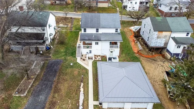 a view of swimming pool with a yard and plants
