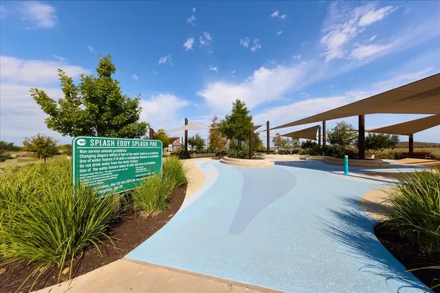 swimming pool view with a yard