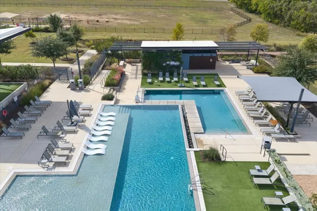 an aerial view of a house with a ocean view