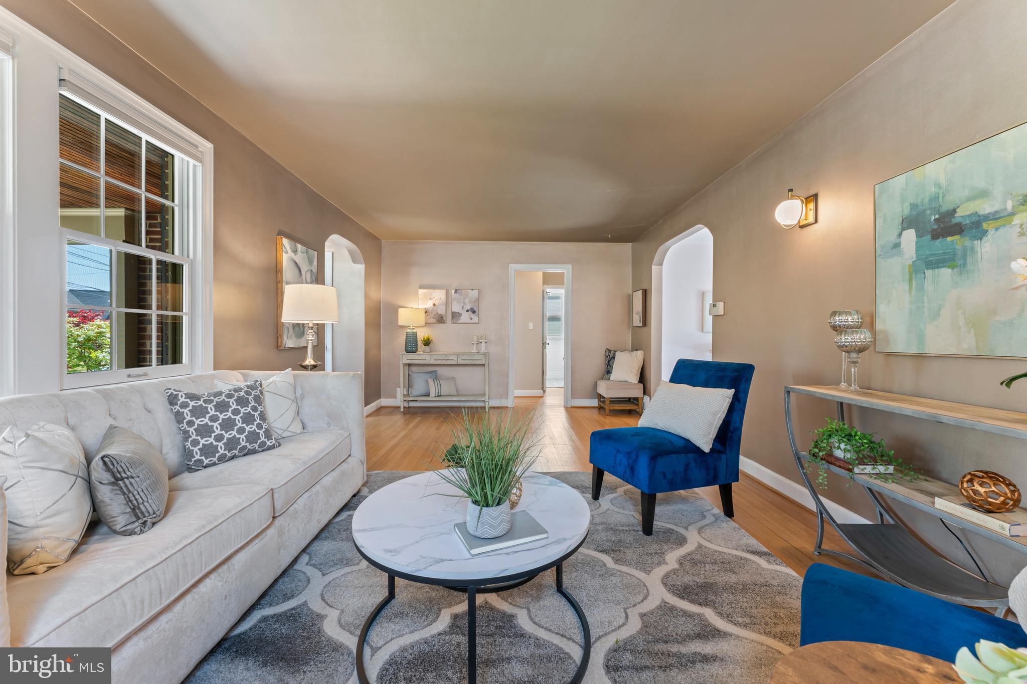 9906 Rogart Road Silver Spring, MD 20901 - Photo 11 of 68 a living room with furniture and a large window