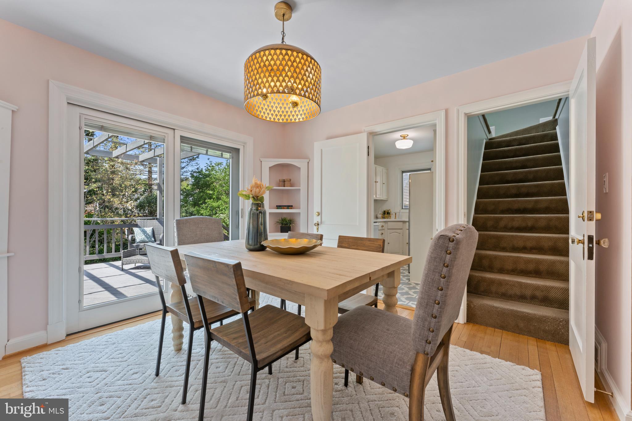 9906 Rogart Road Silver Spring, MD 20901 - Photo 13 of 68 a view of a dining room with furniture window and wooden floor