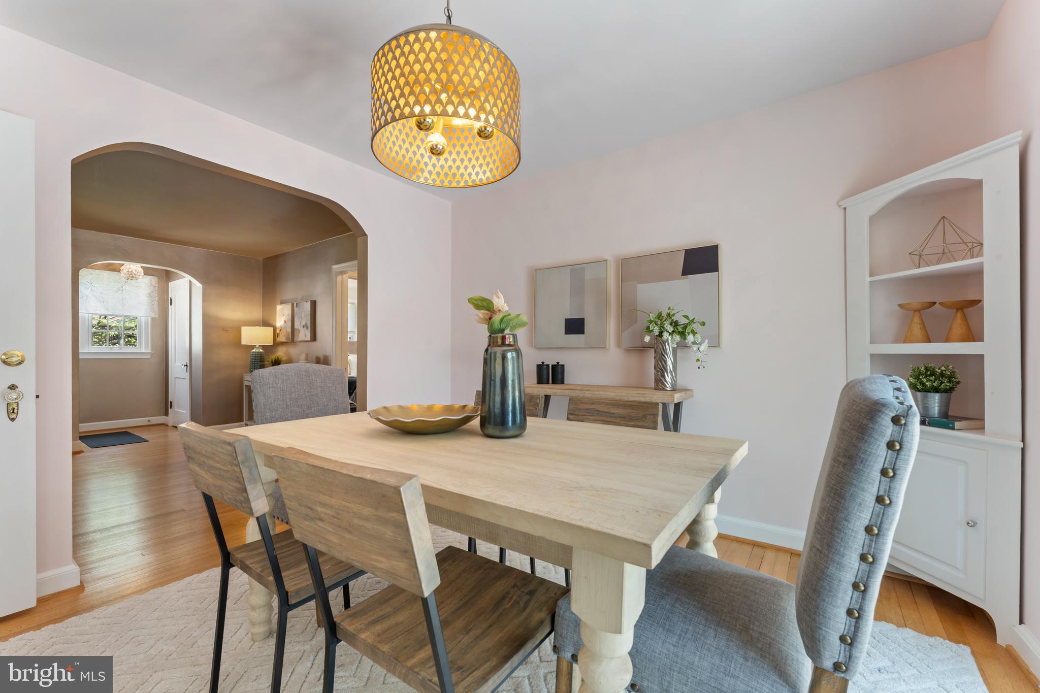 9906 Rogart Road Silver Spring, MD 20901 - Photo 14 of 68 a view of a dining room with furniture and wooden floor