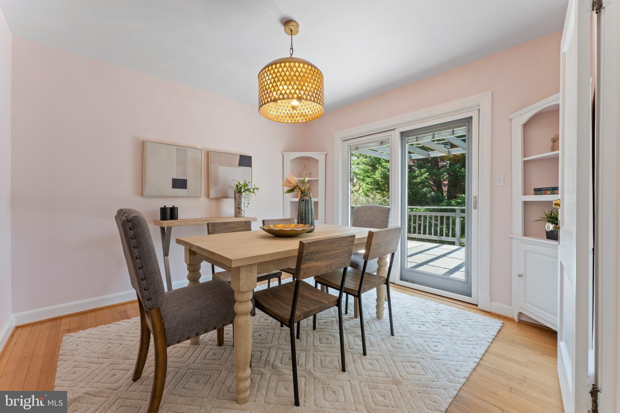 9906 Rogart Road Silver Spring, MD 20901 - Photo 15 of 68 a view of a dining room with furniture window and wooden floor