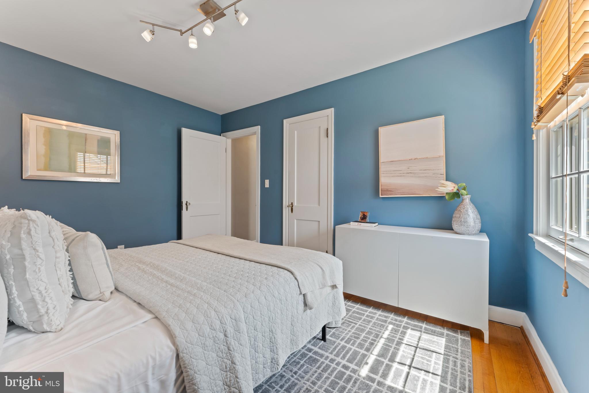 9906 Rogart Road Silver Spring, MD 20901 - Photo 24 of 68 a bedroom with a bed and a window
