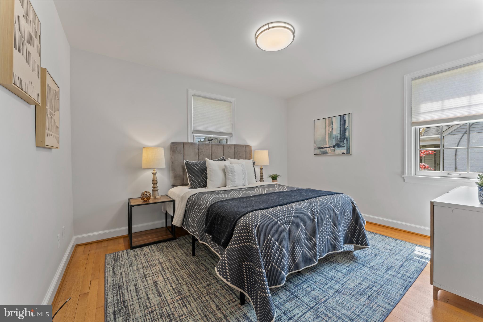 9906 Rogart Road Silver Spring, MD 20901 - Photo 26 of 68 a bedroom with a bed and wooden floor
