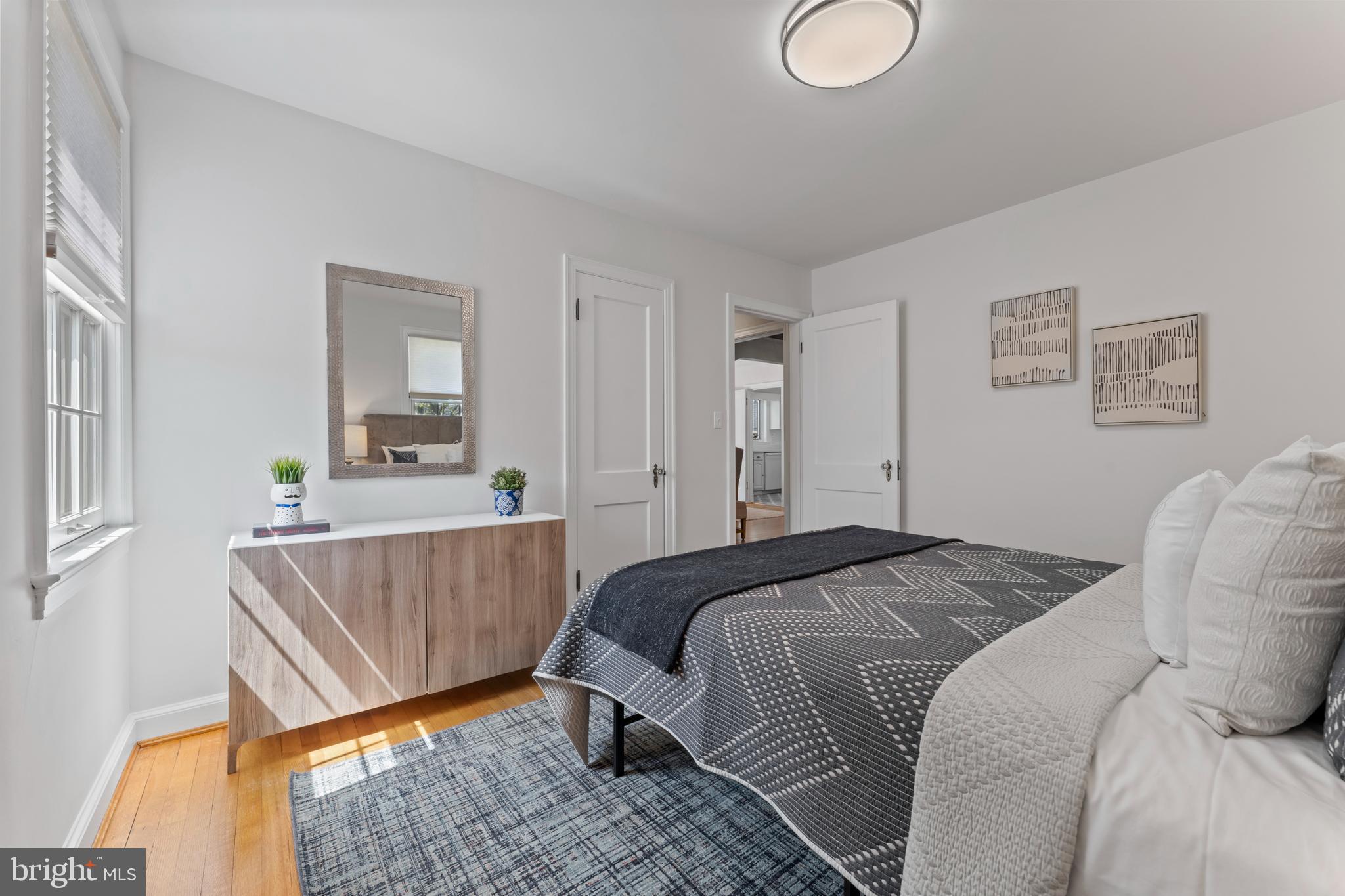 9906 Rogart Road Silver Spring, MD 20901 - Photo 28 of 68 a bed room with a bed and a window