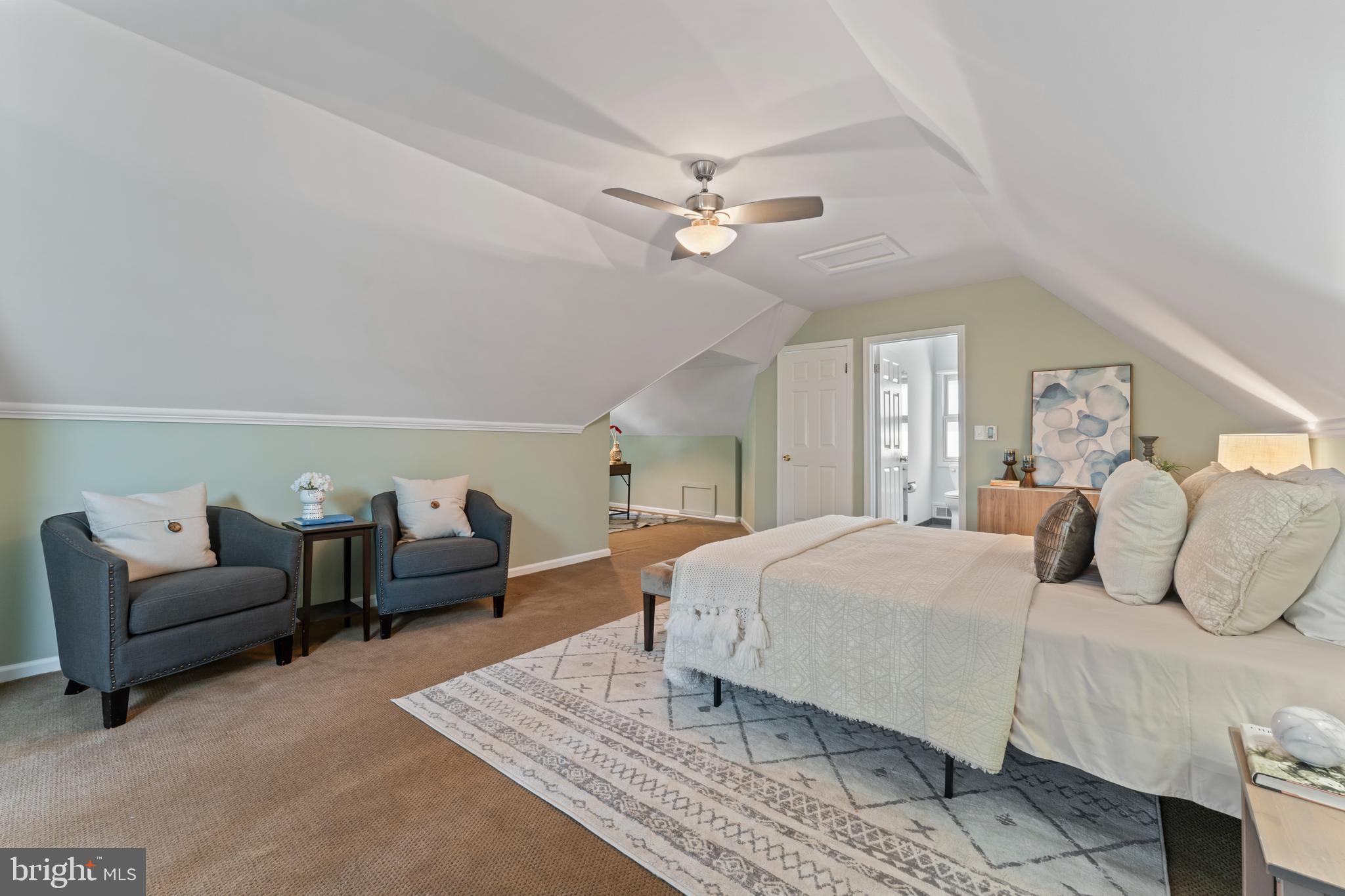 9906 Rogart Road Silver Spring, MD 20901 - Photo 40 of 68 a bedroom with a large bed and ceiling fan