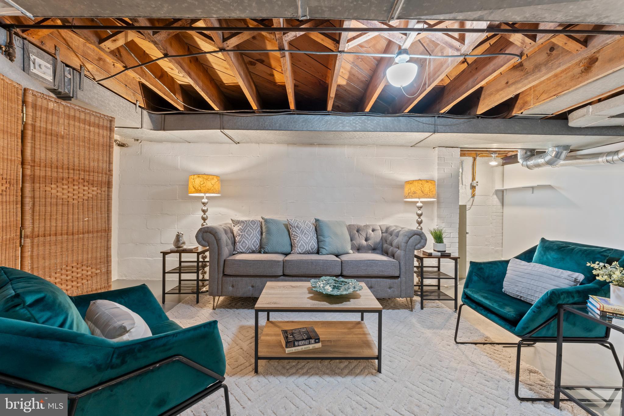 9906 Rogart Road Silver Spring, MD 20901 - Photo 47 of 68 a outdoor living space with furniture and a black umbrella