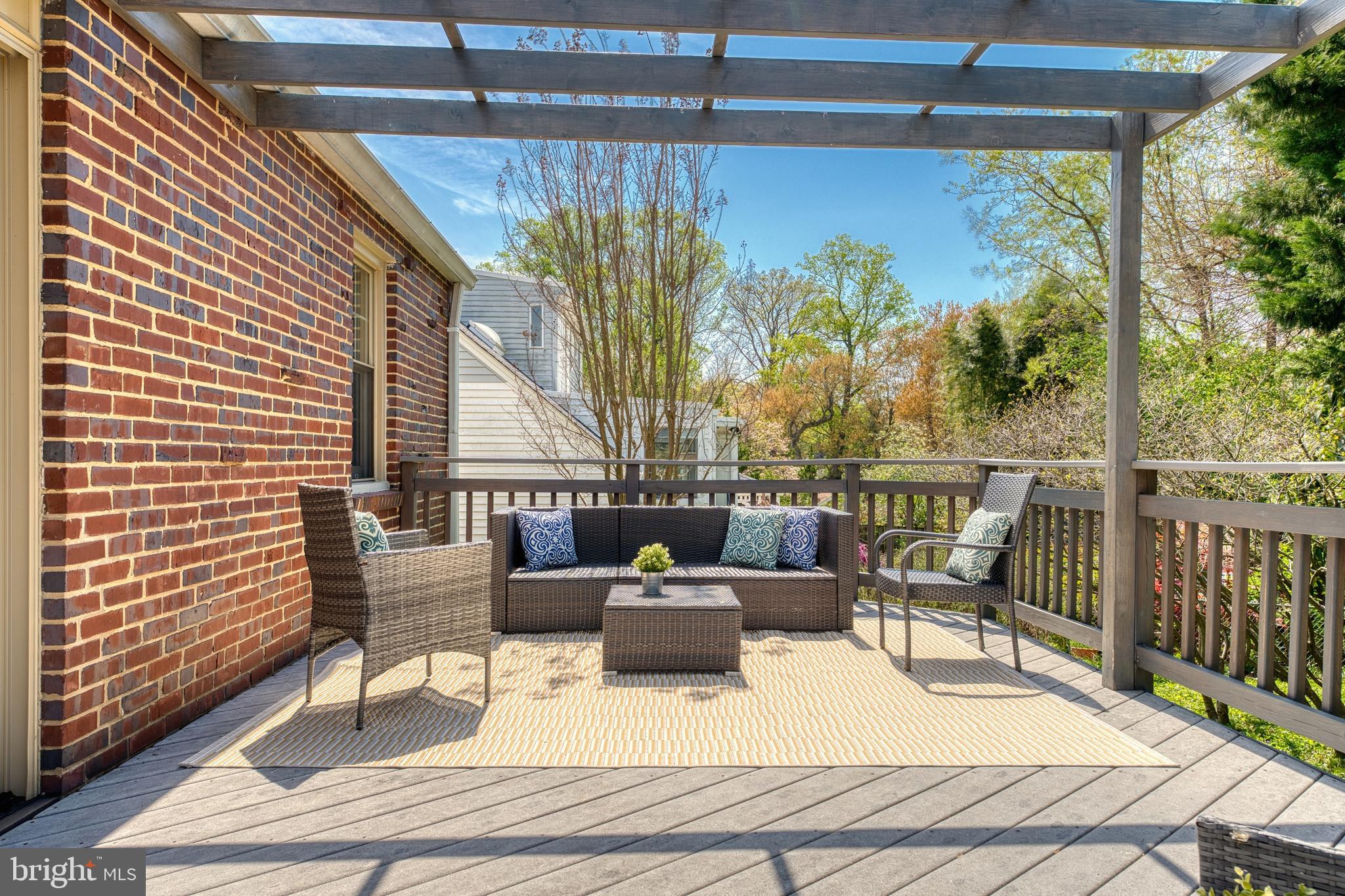 9906 Rogart Road Silver Spring, MD 20901 - Photo 59 of 68 a living room with patio furniture and a potted plant