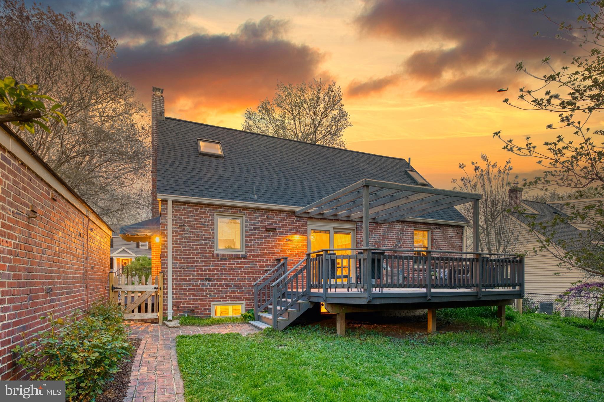 9906 Rogart Road Silver Spring, MD 20901 - Photo 61 of 68 a backyard of a house with a garden and deck