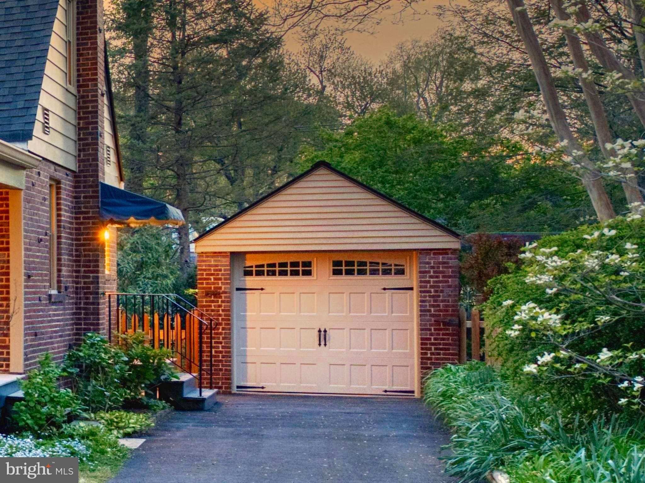 9906 Rogart Road Silver Spring, MD 20901 - Photo 64 of 68 a front view of a house with a garden