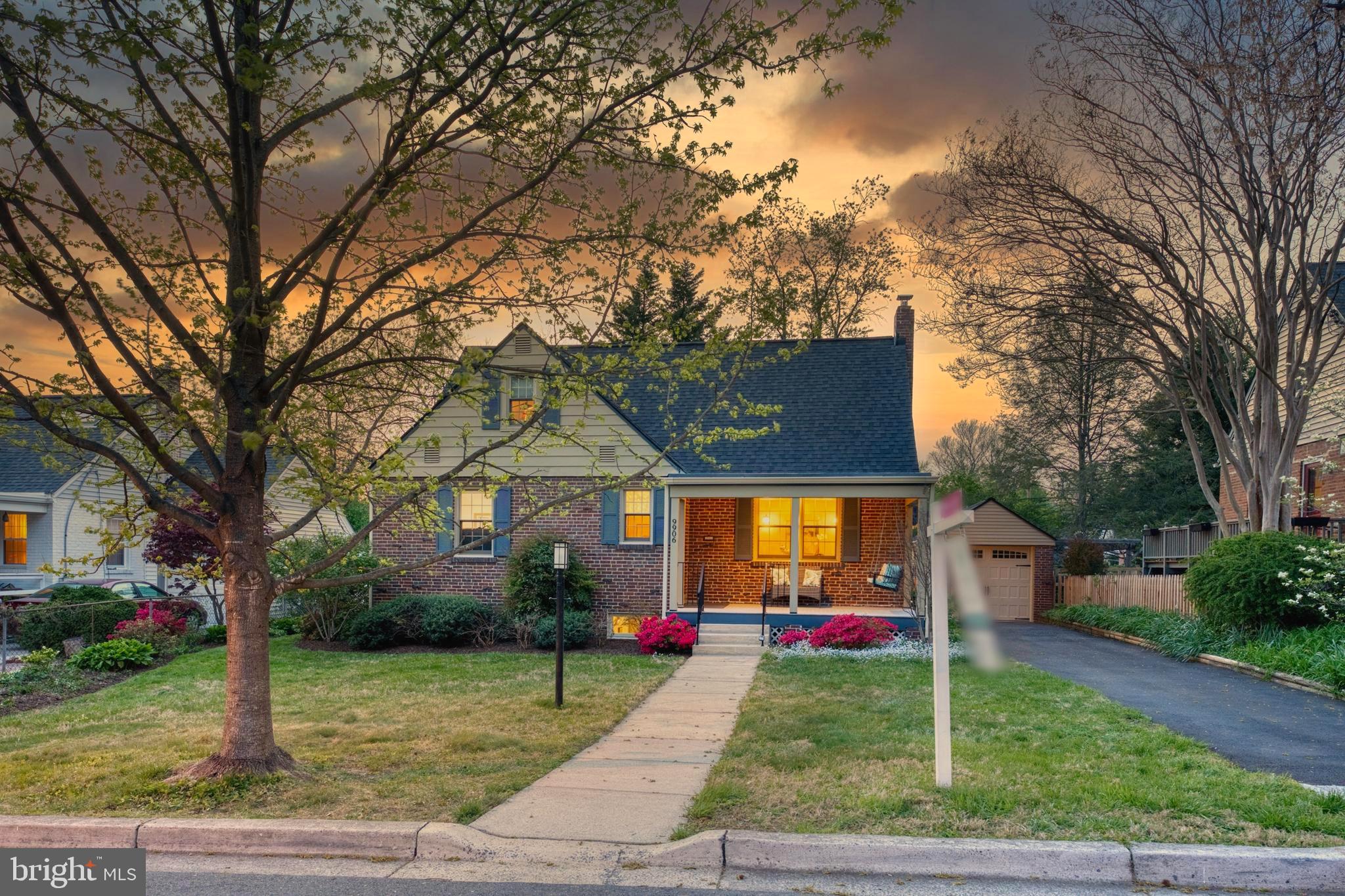 9906 Rogart Road Silver Spring, MD 20901 - Photo 68 of 68 a view of a yard in front of a house with large trees