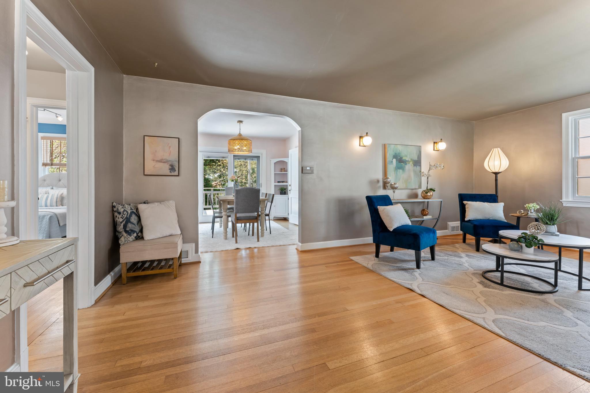 9906 Rogart Road Silver Spring, MD 20901 - Photo 7 of 68 a living room with furniture and a wooden floor
