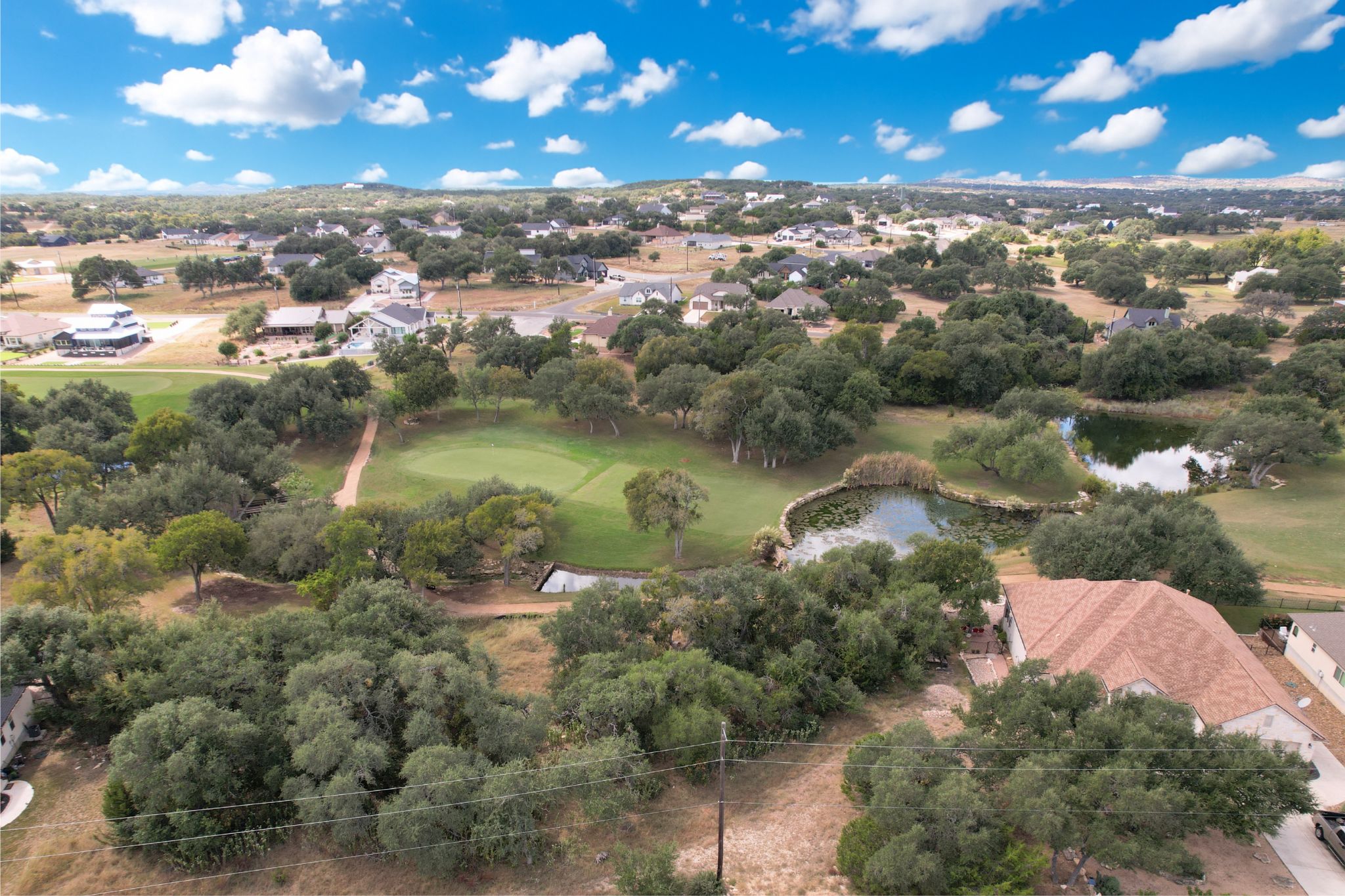 204 Jeff Vaughn Blanco, TX 78606 - Photo 1 of 13 a view of a lake in middle of a city