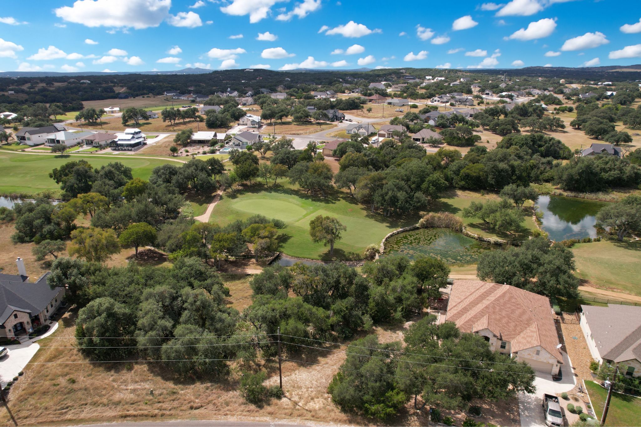 204 Jeff Vaughn Blanco, TX 78606 - Photo 11 of 13 an aerial view of residential houses with outdoor space and swimming pool