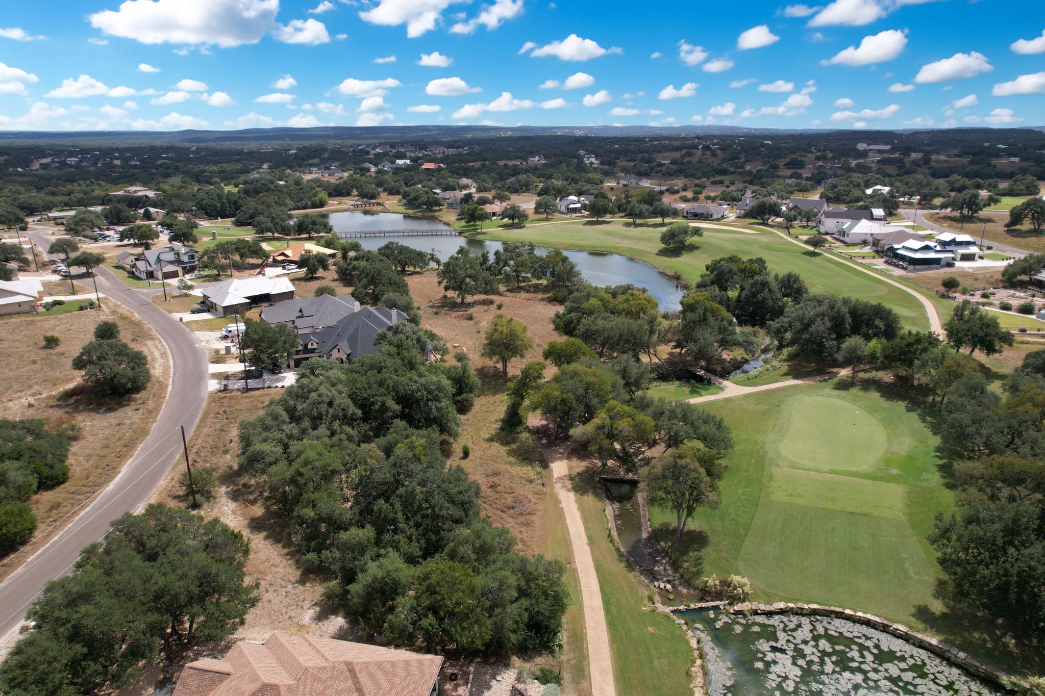 204 Jeff Vaughn Blanco, TX 78606 - Photo 12 of 13 an aerial view of a residential houses with a yard and lake view